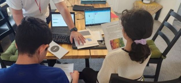 Students collaborating on CodyNick projects with support from their mentor (Canada)